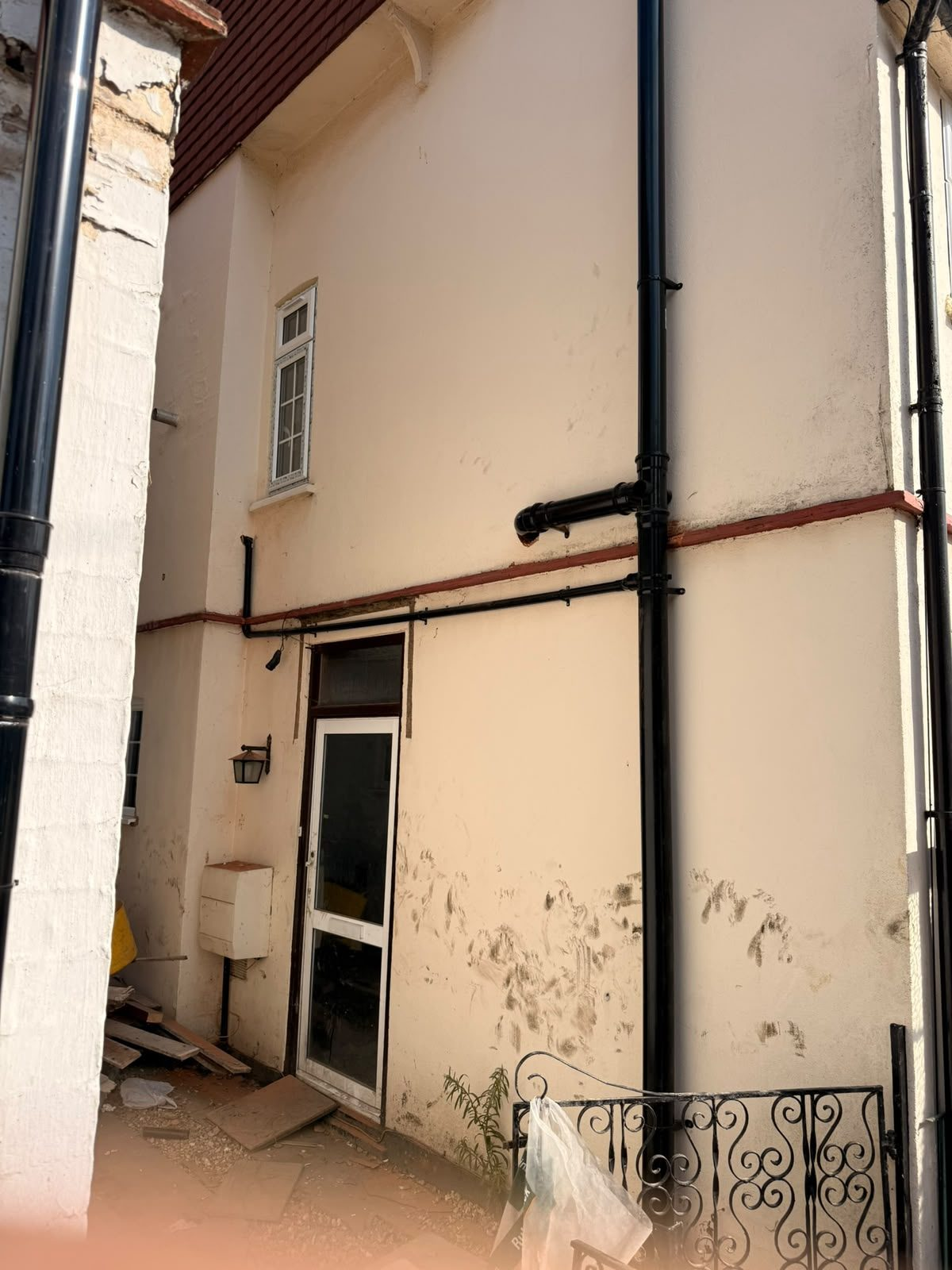 External black soil and waste pipework installed up the outside wall of a house during a drainage upgrade